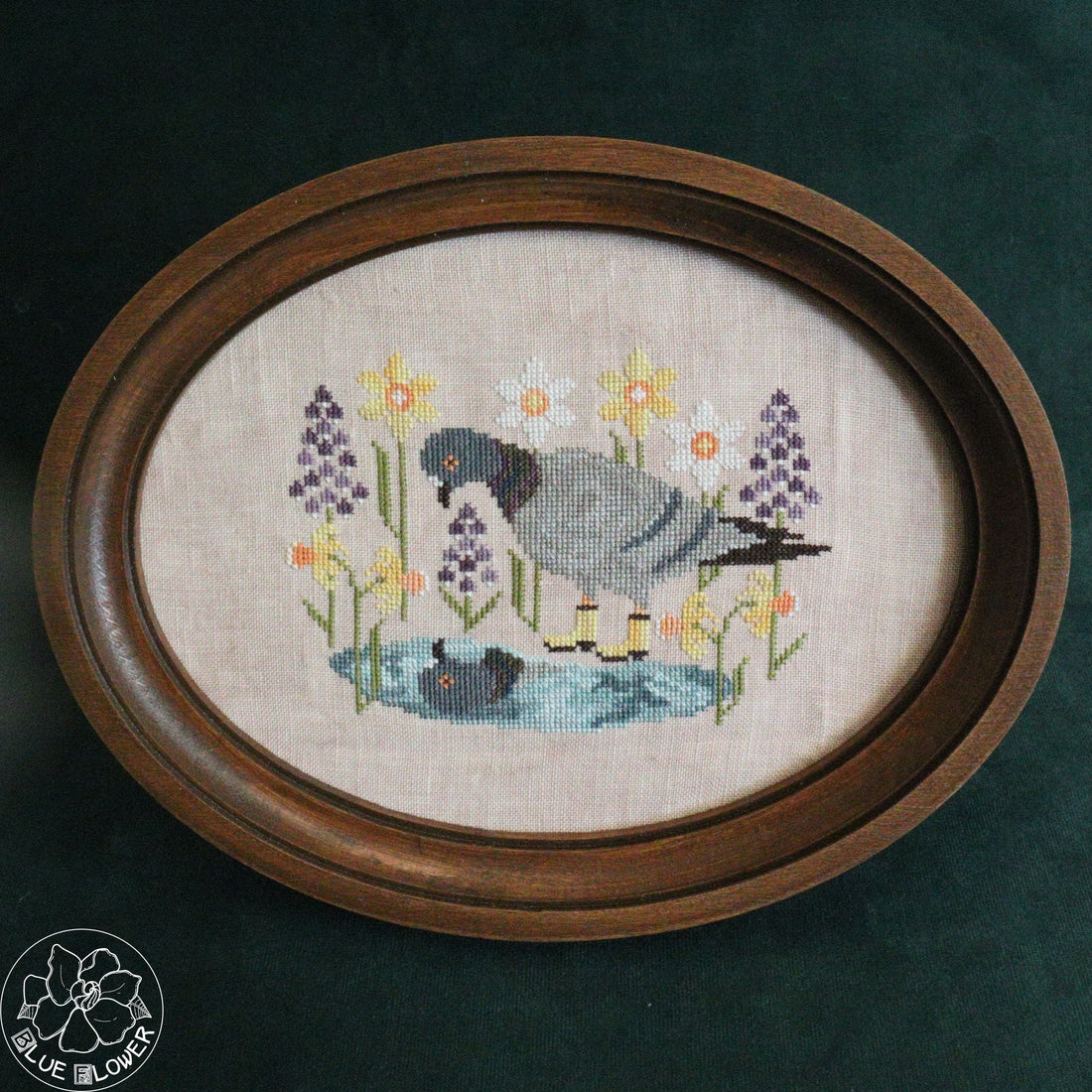 Pigeon cross stitch pattern with blue flower stitching