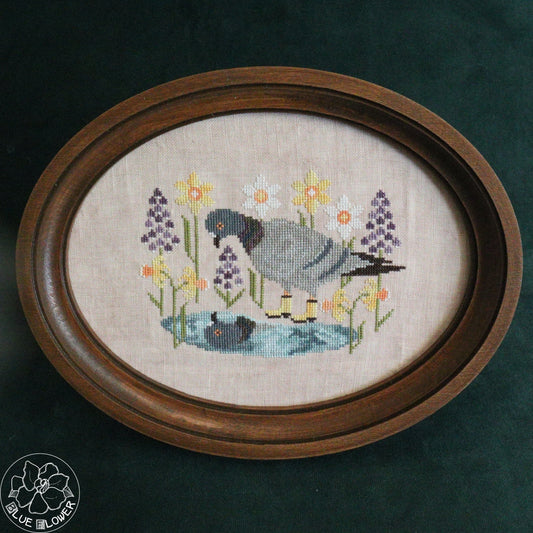 Pigeon cross stitch pattern with blue flower stitching