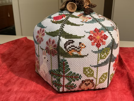 Cross stitched gift box with trees and woodland creatures for cross stitch ideas for gifts