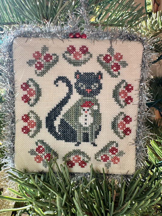 Cat stitch design showing a small cross stitch pattern for a quick handmade project.